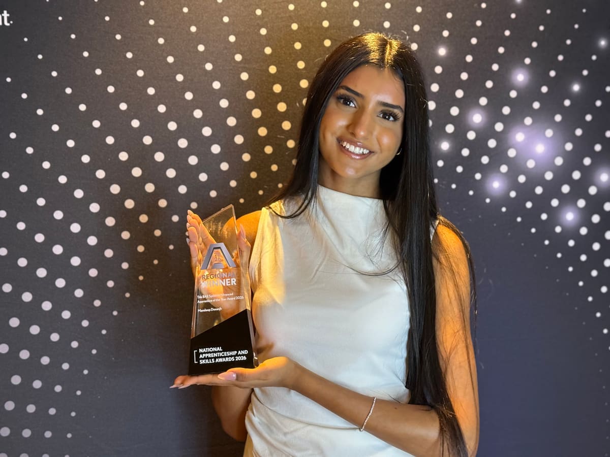Mandeep Dosanjh holding her West Midlands Advanced Apprentice of the Year award